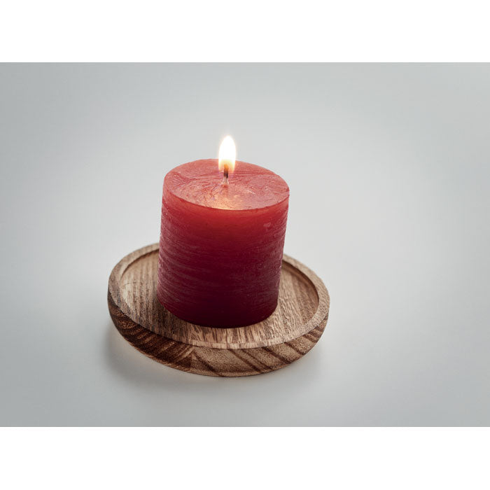 Candle on round wooden base