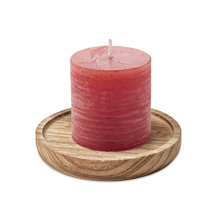 Candle on round wooden base