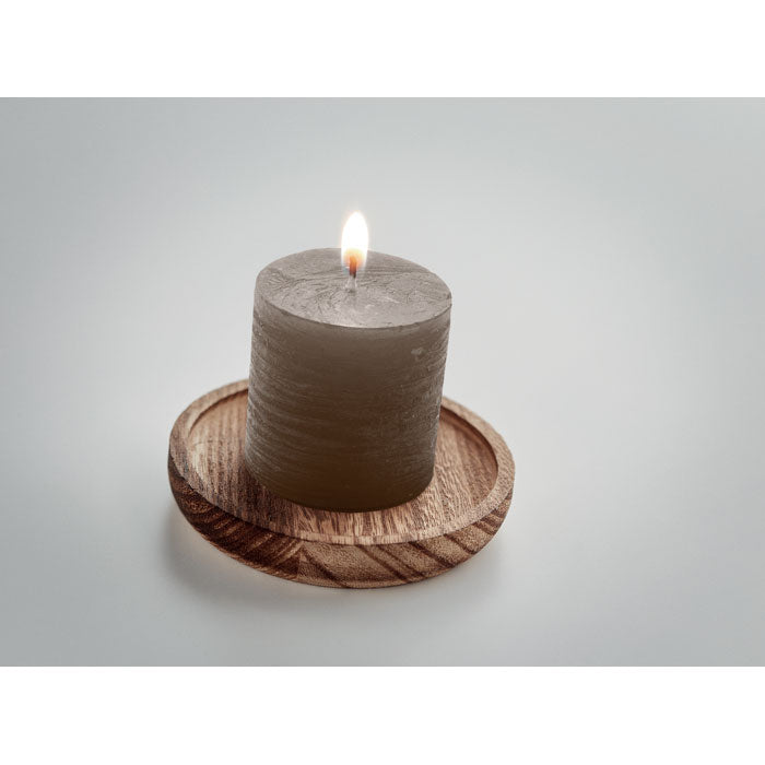 Candle on round wooden base