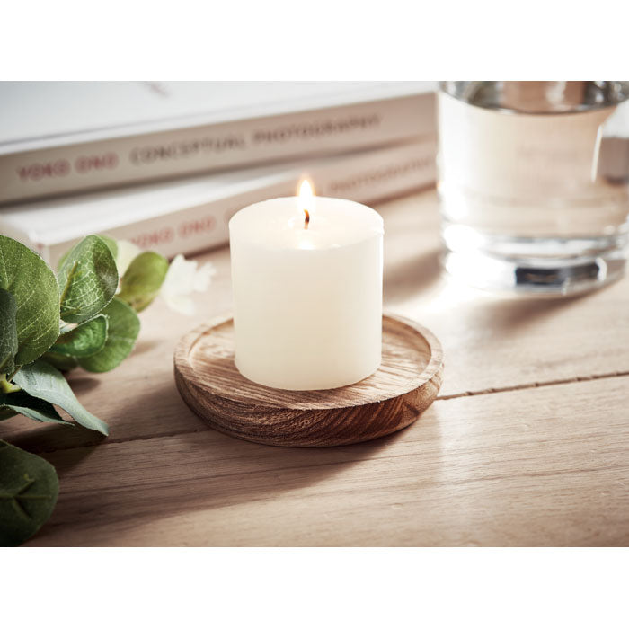 Candle on round wooden base