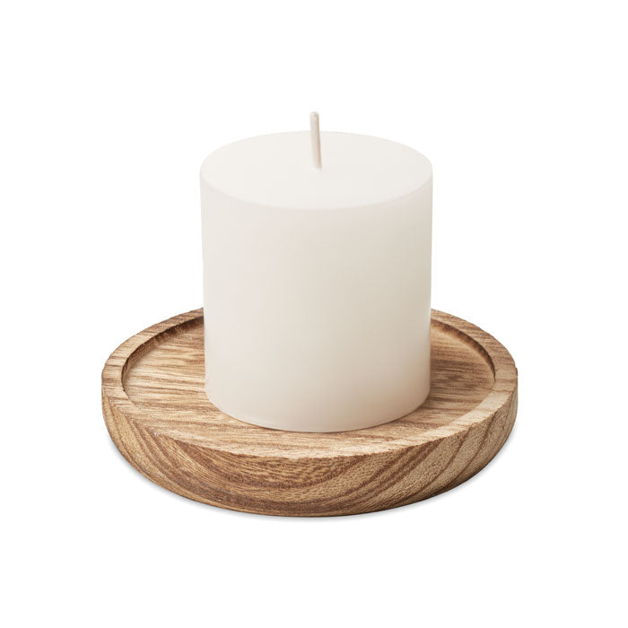 Candle on round wooden base